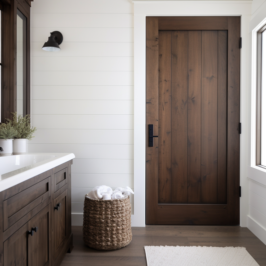 A single panel interior alder door, fully customizable, stained dark brown tobacco cigar color. Handcrafted and bespoke. Pictured in a modern farmhouse bathroom door